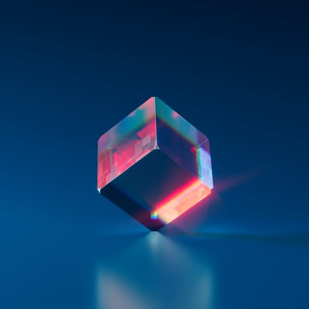 colored and shiny cube on blue background